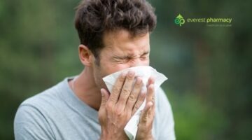 Man sneezing outdoors to illustrate hayfever