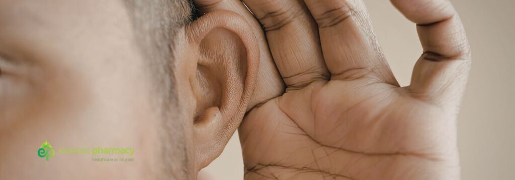 Man cupping his ear