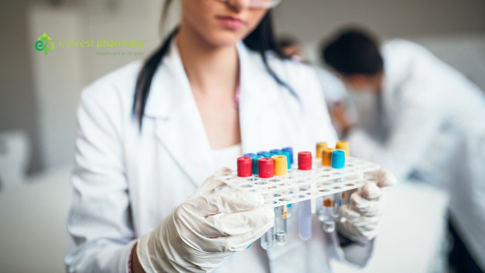 Pharmacist holding vacutainers