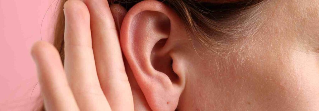 Up close blocked ear being cupped