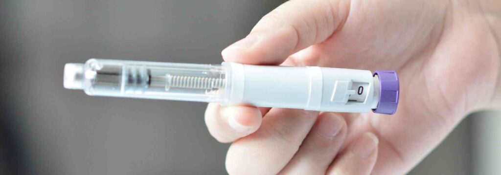 Close up image of a weight loss medication pen