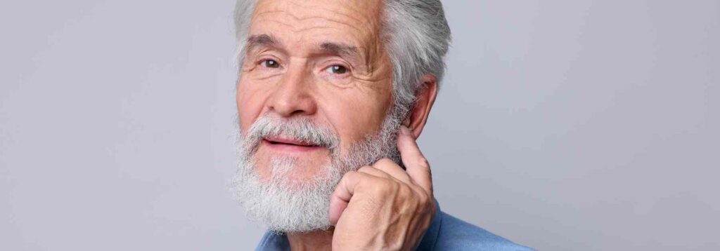 Older man experiencing blocked ears
