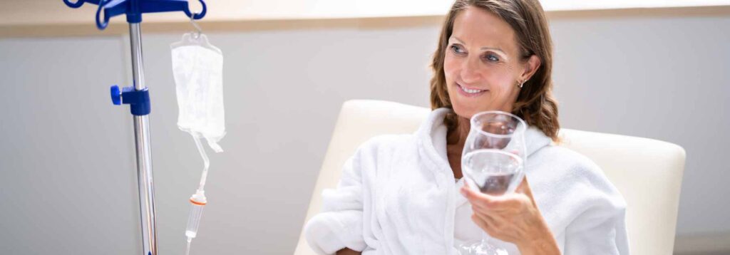 Woman getting an IV drip infusion