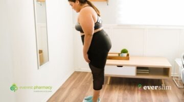 Woman standing on weighing scales