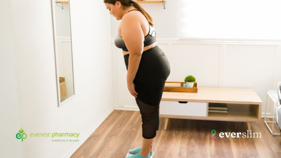 Woman standing on weighing scales