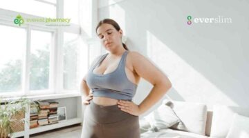Overweight woman confronting weight loss in gym wear