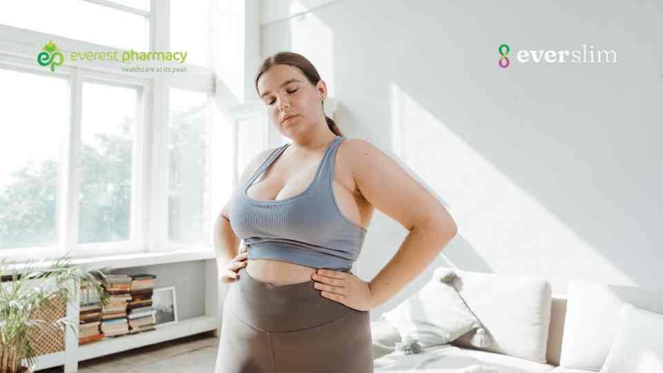 Overweight woman confronting weight loss in gym wear