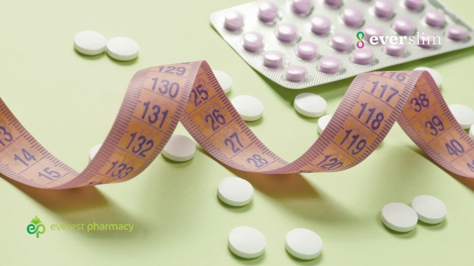 white pills on green background with measuring tape